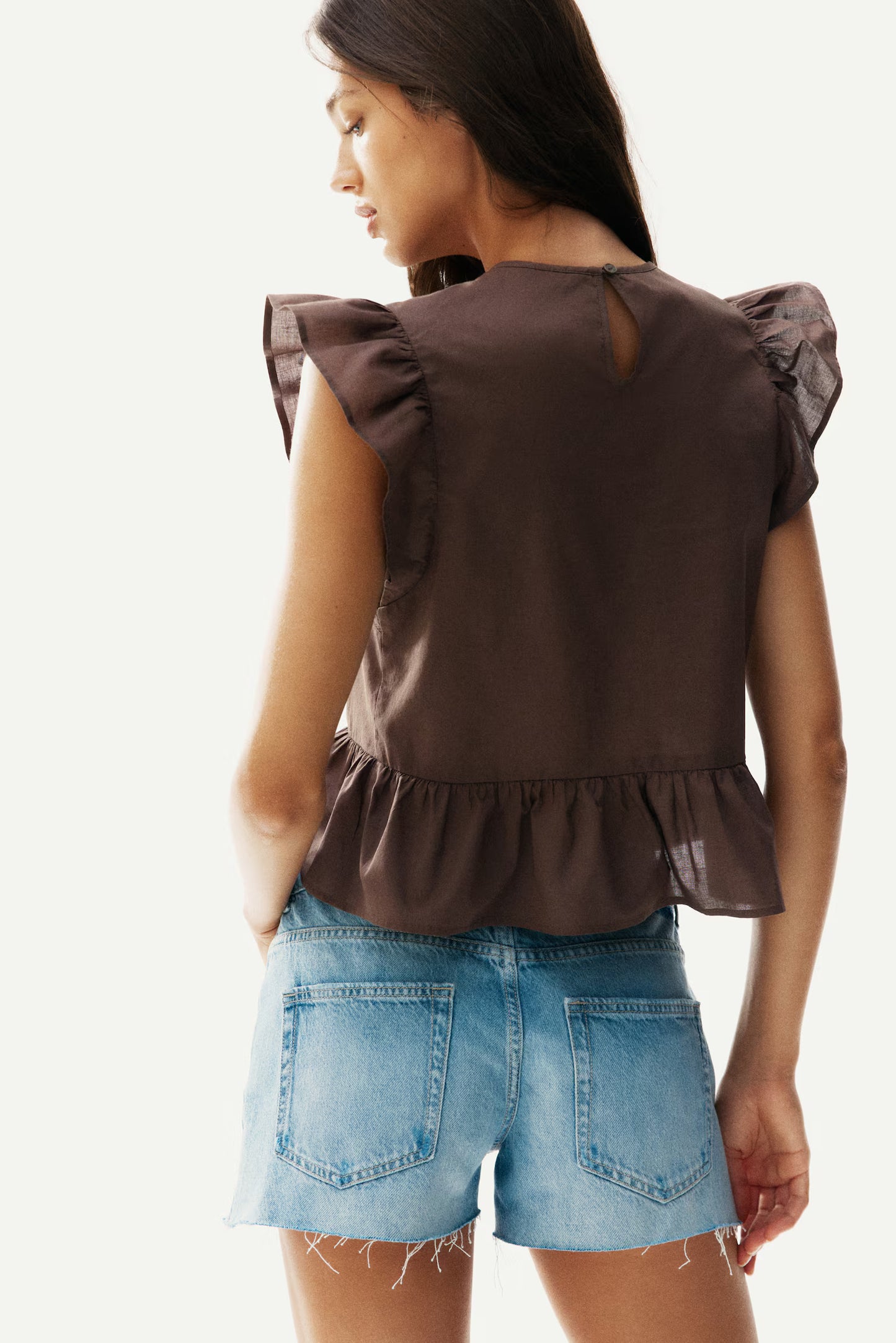 Blusa con inserciones de encaje y peplum