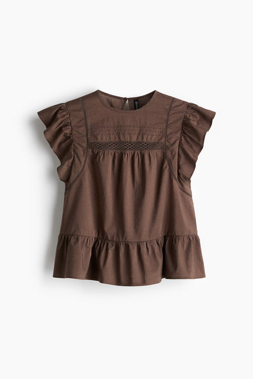 Blusa con inserciones de encaje y peplum - H&M